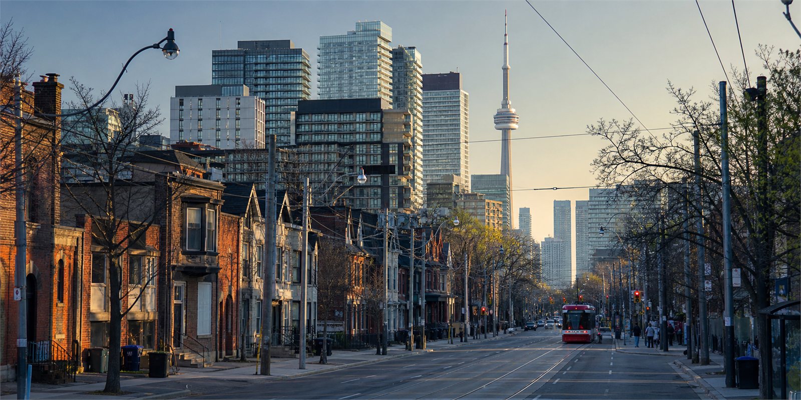 Toronto streetscape with neighbourhood buildings, transit and the downtown skyline